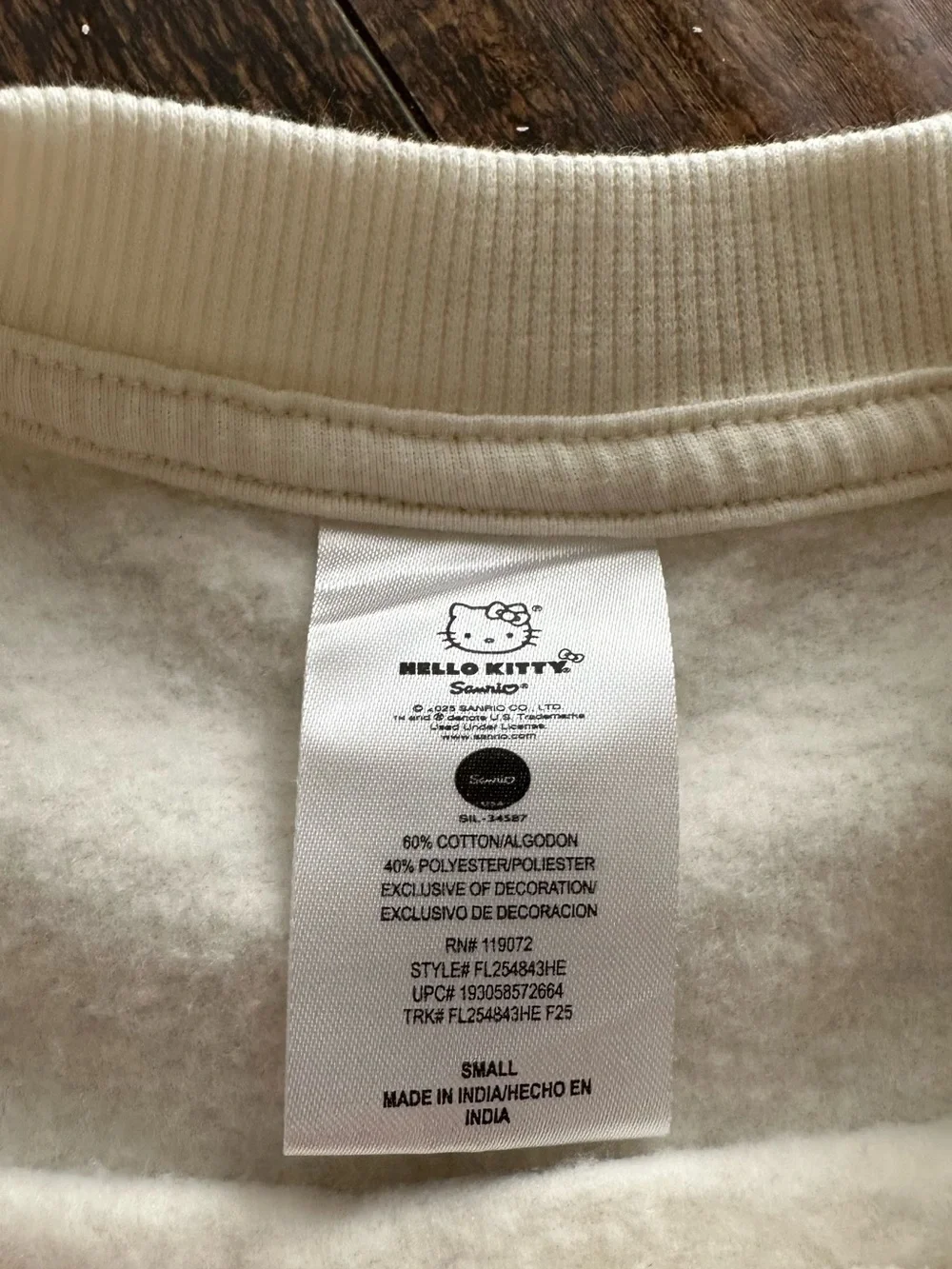 Hello Kitty Cream Crewneck Sweater with Black Star Accents